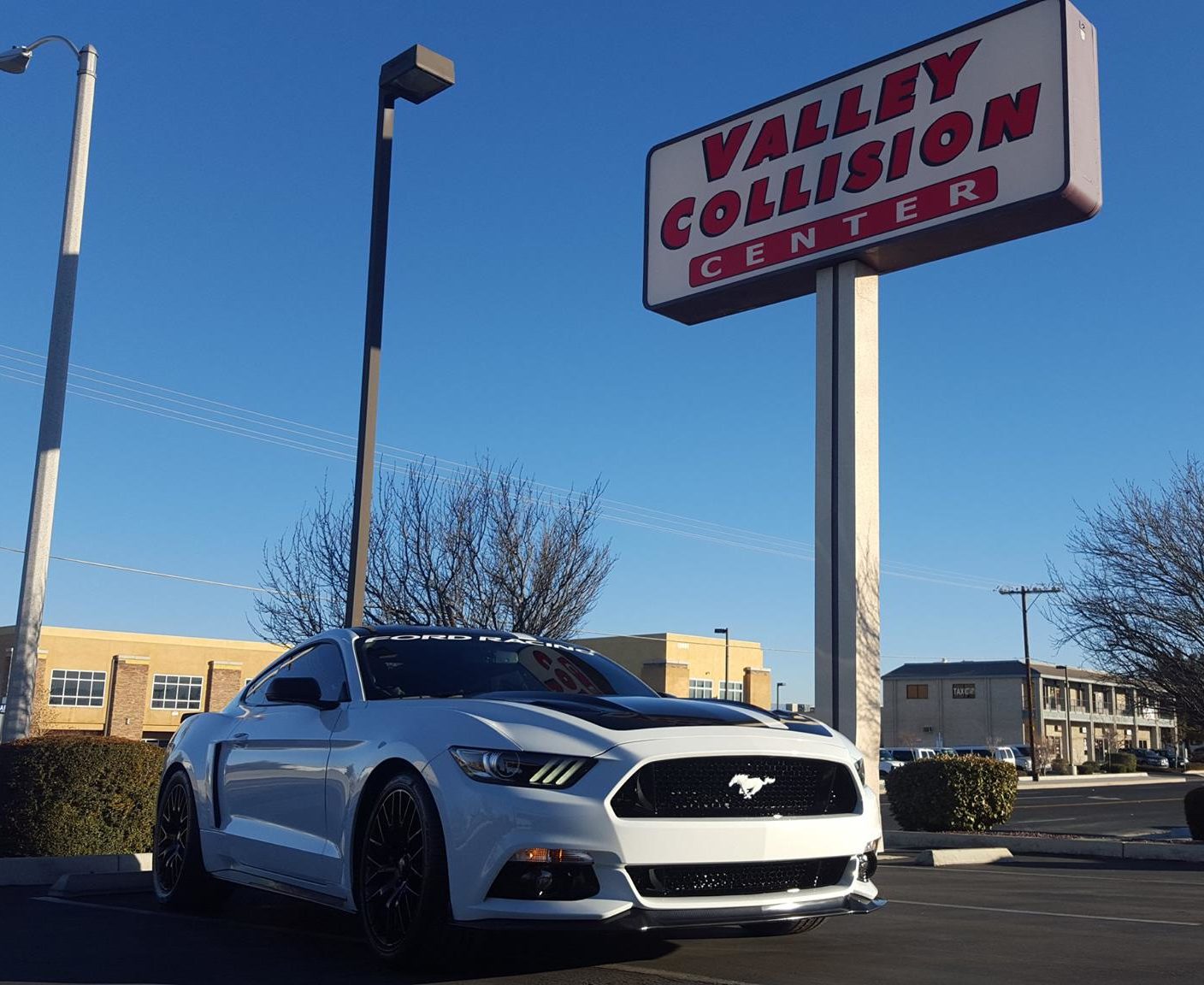 valley collision center parking lot sign
